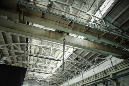 Chain slings hooks overhead crane in the Assembly shop.