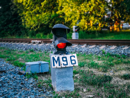 The semaphore on the railroad with red light shines.の写真素材