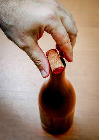 Top view of a bottle of wine with a cork on it.の写真素材