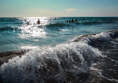 Storm at sea during sunset. Waves splashing against the shore.のeditorial素材