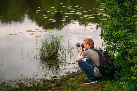 06,21,2019 Russia, Bryansk. A photographer takes a landscape.のeditorial素材