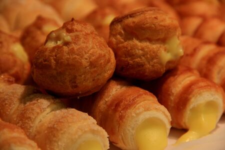 Cannoli are Sicilian pastry desserts with the cream insideの写真素材