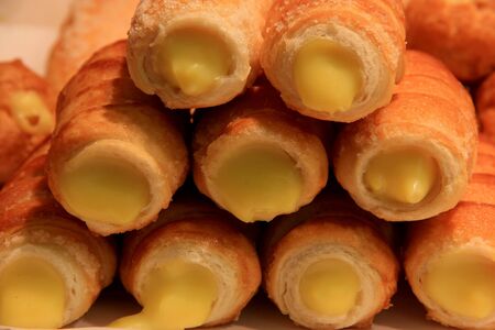 Cannoli are Sicilian pastry desserts with the cream insideの写真素材