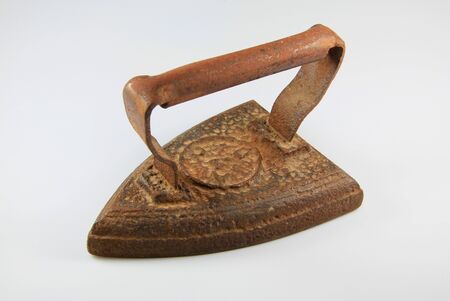 Old rusted iron useful for ironing clothesの写真素材