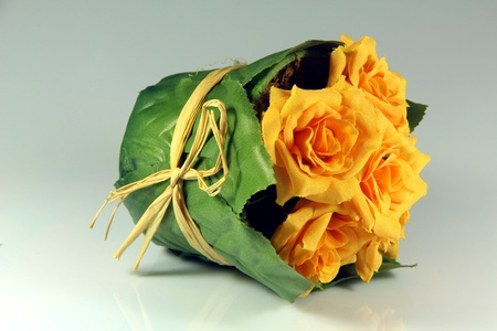 Fake yellow flower with green base and yellow streep の写真素材