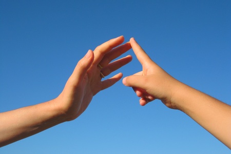 Count with the fingers, child's hand in the hand of an adultの写真素材