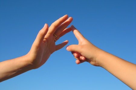 Count with the fingers, child's hand in the hand of an adultの写真素材