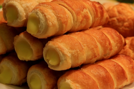 Cannoli are Sicilian pastry desserts with the cream insideの写真素材