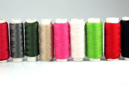 Spools of colored cotton thread to sew clothes and moreの写真素材