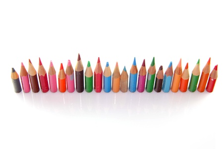 Orderly row  of short pencils of different colorsの写真素材