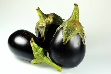 Big violet eggplant isolated on white background の写真素材