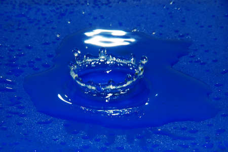 Beautifull blu water drop and water ringsの写真素材