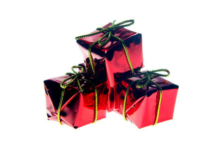 Santa Claus red gifts with golden ribbon isolated on white backgroundの写真素材