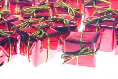 Santa Claus red gifts with golden ribbon isolated on white backgroundの写真素材