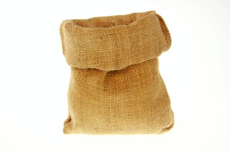 An empty jute bag with white backgroundの写真素材