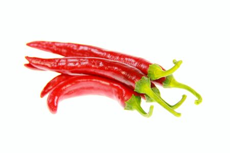 Some isolated red peppers with white backgroundの写真素材