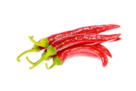 Some isolated red peppers with white backgroundの写真素材