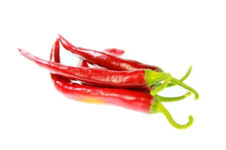 Some isolated red peppers with white backgroundの写真素材