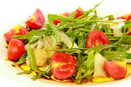 Rocket salad cheese tomatoes  and vinegar with white background の写真素材