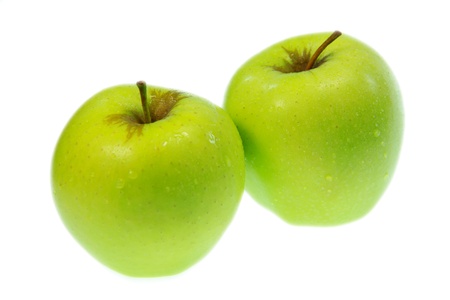 Close up of two delicious green applesの写真素材