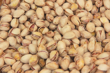 Pile of delicious pistachio nuts in their shellsの写真素材
