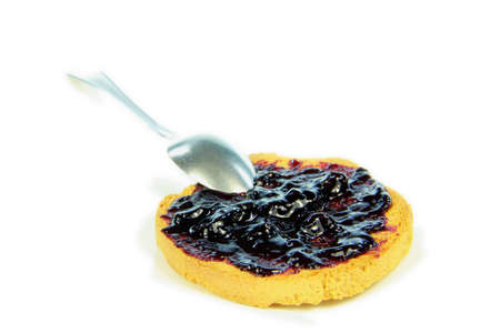 Toast with blueberry jam and white backgroundの写真素材