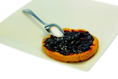 Toast with blueberry jam and white backgroundの写真素材