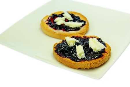 Toast with blueberry jam and white backgroundの写真素材