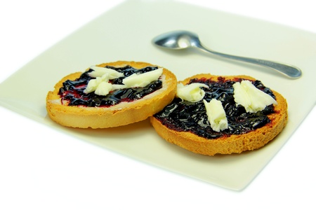 Toast with blueberry jam and white backgroundの写真素材