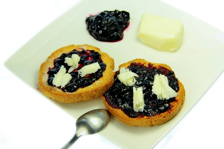 Toast with blueberry jam and white backgroundの写真素材