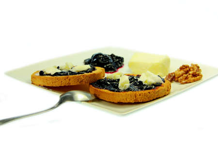Toast with blueberry jam and white backgroundの写真素材