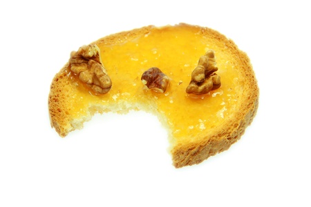 Tasty toast with honey with white backgroundの写真素材