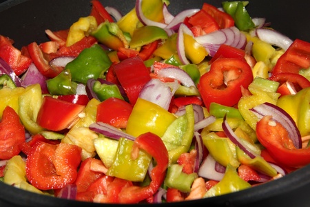 Pieces of fresh pepper ready to be cookedの写真素材