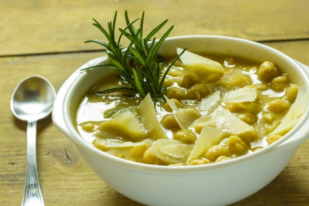 A bowl of chickpea soup on the tableの写真素材