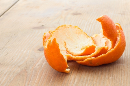 Tangerine peel on the table in front of a windowの写真素材