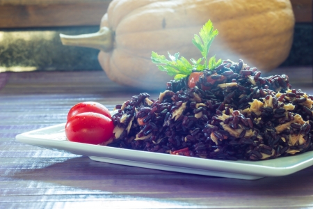 Black rice with tuna and tomatoesの写真素材
