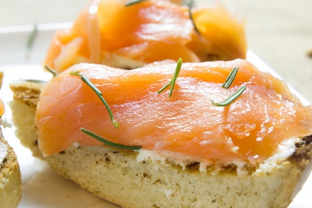 A plate of tarts with smoked salmonの写真素材