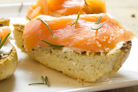 A plate of tarts with smoked salmonの写真素材