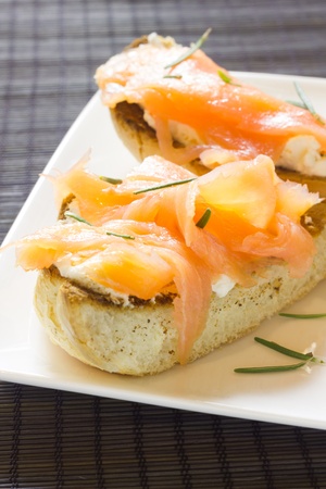 A plate of tarts with smoked salmonの写真素材