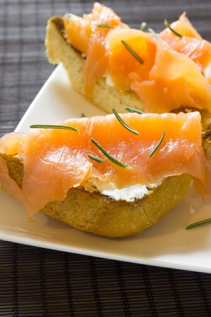 A plate of tarts with smoked salmonの写真素材