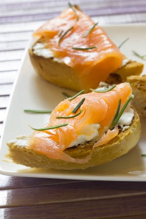 A plate of tarts with smoked salmonの写真素材