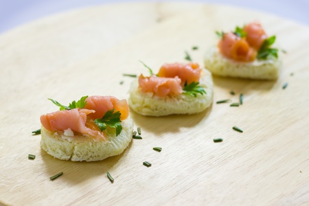 Close up view of  tarts with smoked salmon