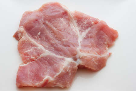 A close up view of same pork steaksの写真素材