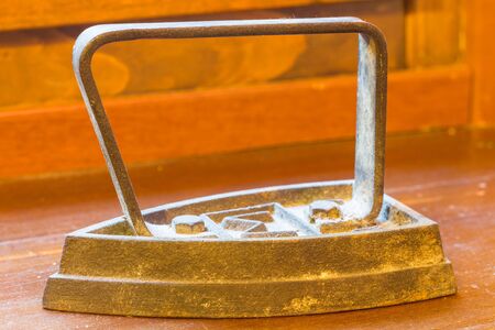 Old rusted iron useful for ironing clothesの写真素材