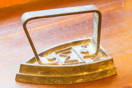 Old rusted iron useful for ironing clothesの写真素材