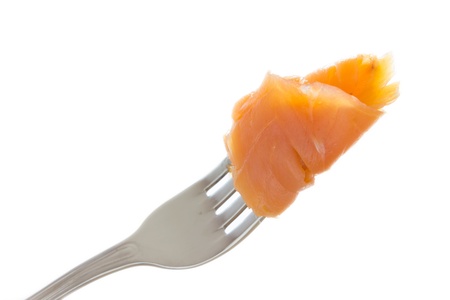 Close up view of a fork with smoked salmonの写真素材