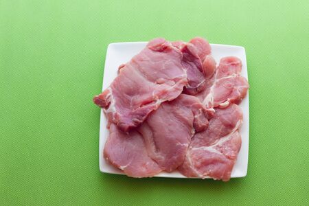 A close up view of same pork steaksの写真素材