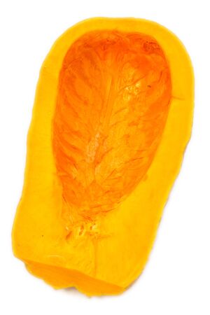 A pumpkin on the table in front of a windowの写真素材