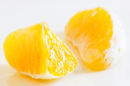 Close up view of same orange segmentsの写真素材