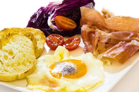 Cose up view of fried eggs with baconの写真素材